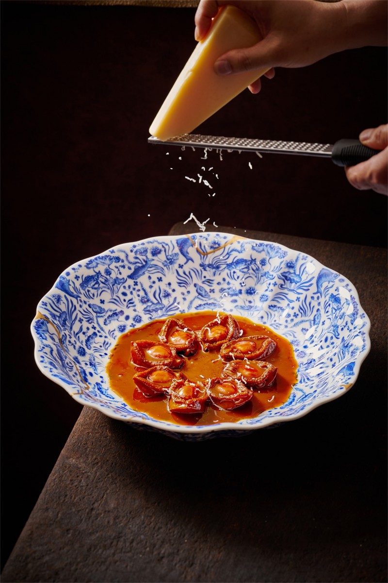 Four fresh abalone paired with Parmesan cheese